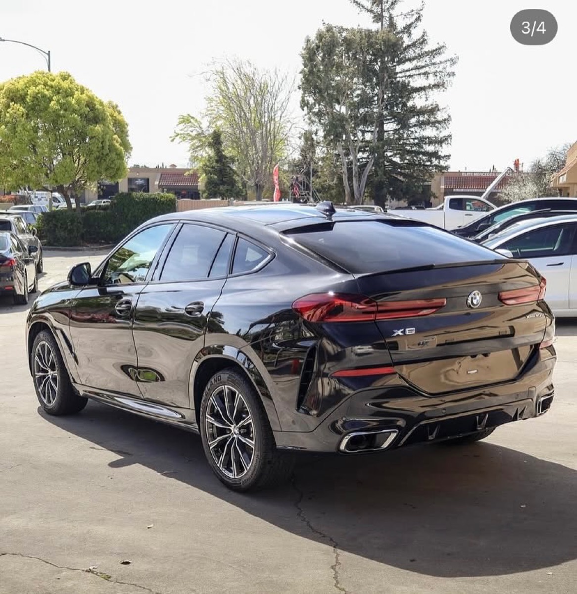 Freshly detailed black BMW X6 with a deep mirror shine