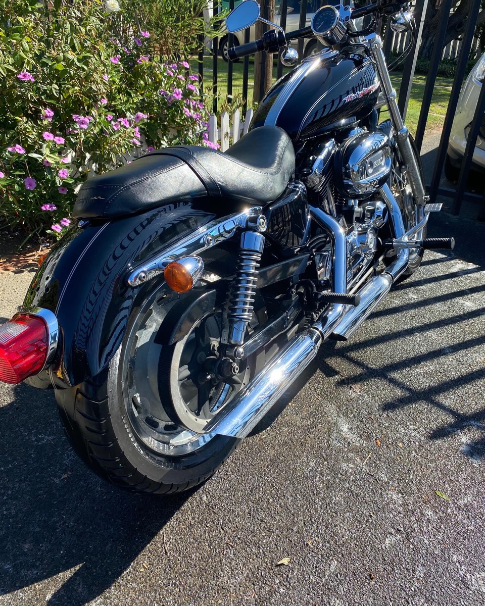 Gleaming black and chrome Harley-Davidson after detailing